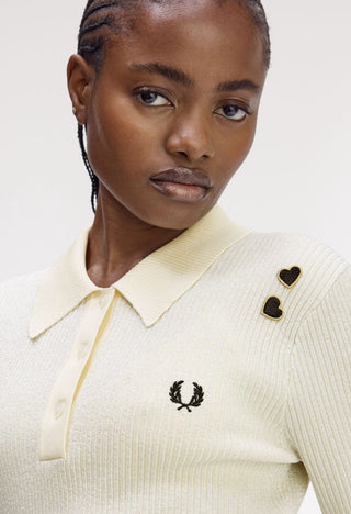 Polo in maglia metallizzata a coste.